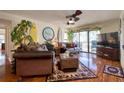 Comfortable living room with hardwood floors and leather furniture at 1488 Pine Glen Ln # B2, Tarpon Springs, FL 34688