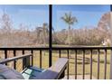 Tranquil screened balcony overlooking a pond at 1488 Pine Glen Ln # B2, Tarpon Springs, FL 34688