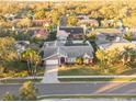 An aerial view showcasing a single-Gathering home in a residential neighborhood at 1811 Stonebrook Ln, Safety Harbor, FL 34695