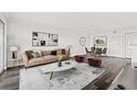 Bright living room with contemporary furniture and large windows at 2400 Feather Sound Dr # 127, Clearwater, FL 33762