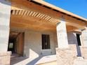 Under-construction covered porch, brick columns and wooden beams at 422 Shannon Estates Ct, Plant City, FL 33563