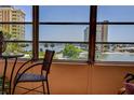 Relaxing view from a window, overlooking a tranquil waterfront scene at 4575 Cove Cir # 304, St Petersburg, FL 33708