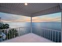 Spacious balcony overlooking the water with sunset views at 6423 Driftwood Dr, Hudson, FL 34667
