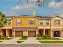 Two-story townhome with a two-car garage at 11902 Greengate Dr, Hudson, FL 34669