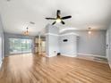 Spacious living area with light gray walls and wood-look floors at 10454 Ventura Dr, Spring Hill, FL 34608