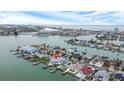 Aerial view of waterfront home with private dock and pool at 11185 5Th E St, Treasure Island, FL 33706