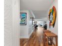 Entryway with hardwood floors, leading to living area at 131 Bluff View Dr # 103, Belleair Bluffs, FL 33770
