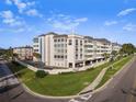 Exterior view of Port Belair building, showcasing its architecture and landscaping at 131 Bluff View Dr # 103, Belleair Bluffs, FL 33770