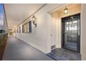 Building hallway with access to apartment entry doors at 131 Bluff View Dr # 103, Belleair Bluffs, FL 33770