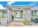 Inviting front entrance with stone pillars and a white door at 1536 W Del Webb Blvd, Sun City Center, FL 33573