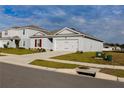 One story house with a two car garage and landscaping at 178 Brofield St, Brooksville, FL 34604