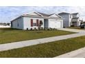 One-story house with a two-car garage and landscaping at 178 Brofield St, Brooksville, FL 34604