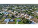 Community overview featuring numerous houses and lush greenery at 3038 Sargeant St, Port Charlotte, FL 33948