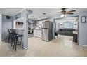 Modern kitchen with stainless steel appliances and breakfast bar at 3421 Cantrell St, Holiday, FL 34690