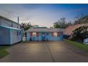 Cute cottage with orange shutters and spacious parking at 5401 Circle Dr, Weeki Wachee, FL 34607