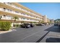 Condo building with parking area in front at 5705 80Th St N # 304, St Petersburg, FL 33709