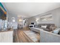 Living room with gray couches and wood-look floors at 5705 80Th St N # 304, St Petersburg, FL 33709