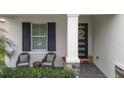 Relaxing front porch with rocking chairs, perfect for enjoying your morning coffee at 5725 Stockport St, Riverview, FL 33578