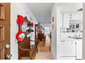 Bright entryway with hardwood floors, vintage bench, and view into living area at 601 N Hercules Ave # 503, Clearwater, FL 33765