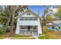 Renovated craftsman home with a white exterior and stone porch at 718 34Th S Ave, St Petersburg, FL 33705
