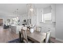 Bright dining room with a contemporary table and chairs, adjacent to the kitchen at 2511 N Grady Ave # 26, Tampa, FL 33607