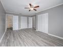 Spacious bedroom with wood-look floors and large closets at 34027 Saint Joe Rd, Dade City, FL 33525