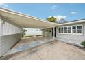 Carport providing covered parking with an attached home at 3435 Overlook Ne Dr, St Petersburg, FL 33703
