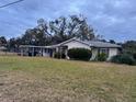 Single story home with a covered carport and large yard at 5 W Spanish Main St, Tampa, FL 33609