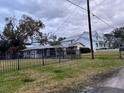 Ranch style home with a large yard and carport at 5 W Spanish Main St, Tampa, FL 33609
