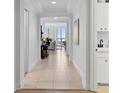 Light-filled hallway leading to living area at 100 Beach Ne Dr # 1501, St Petersburg, FL 33701