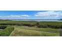Scenic view of a tranquil bay, mangrove trees, and distant cityscape at 1501 Gulf Blvd # 104, Clearwater Beach, FL 33767