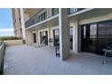 Spacious condo balcony with lounge chairs and grill at 1501 Gulf Blvd # 104, Clearwater Beach, FL 33767