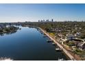 Aerial view showcasing a waterfront property with city skyline in background at 2834 Coffee Pot Ne Blvd, St Petersburg, FL 33704