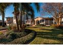 Charming house with lush landscaping, brick walkway, and palm trees at 2834 Coffee Pot Ne Blvd, St Petersburg, FL 33704