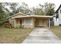 Nice yellow house with carport and small front yard at 619 Glenoak N St, St Petersburg, FL 33703