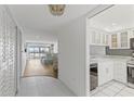 Bright condo entryway with view of living room and kitchen at 105 Island Way # 146, Clearwater, FL 33767