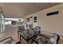 Covered patio with table and chairs, adjacent to home at 18675 Us Highway 19 N # 312, Clearwater, FL 33764