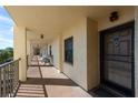 Building hallway with access to various condo units at 19029 Us Highway 19 N # 26-304, Clearwater, FL 33764