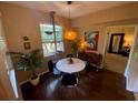 Small dining area with round table and four chairs, near a window at 2010 E Palm Ave # 15305, Tampa, FL 33605
