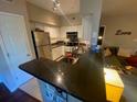 Modern kitchen with stainless steel appliances and granite countertops at 2010 E Palm Ave # 15305, Tampa, FL 33605