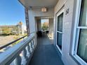 Private balcony with table and chairs at 2461 Rhodesian Dr # 51, Clearwater, FL 33763