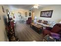 Living room with sofa, chairs, and dining area at 2461 Rhodesian Dr # 51, Clearwater, FL 33763