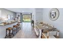 Open concept kitchen and dining area with modern finishes at 32603 Turtle Grace Loop, Wesley Chapel, FL 33545