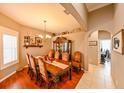 Elegant dining room with hardwood floors and a large table, perfect for Gathering gatherings at 3407 Walden Reserve Dr, Plant City, FL 33566