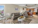 Living room with leather sofa, kitchen, and ocean view at 4510 Gulf Blvd # 408, St Pete Beach, FL 33706