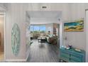 Bright and airy entryway with tiled floors, leading to living area at 670 Island Way # 500, Clearwater Beach, FL 33767