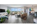 Spacious living room with water views, hardwood floors, and ample natural light at 670 Island Way # 500, Clearwater Beach, FL 33767