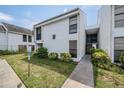 Two-story building exterior with walkway and landscaping at 706 Haven Pl, Tarpon Springs, FL 34689