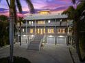 Multi-story waterfront home with a three car garage at 899 Bay Esplanade, Clearwater Beach, FL 33767