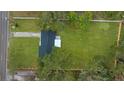 Aerial view showing the house and expansive lawn at 908 Victoria St, Brandon, FL 33510